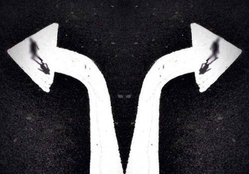man and woman walking in different path