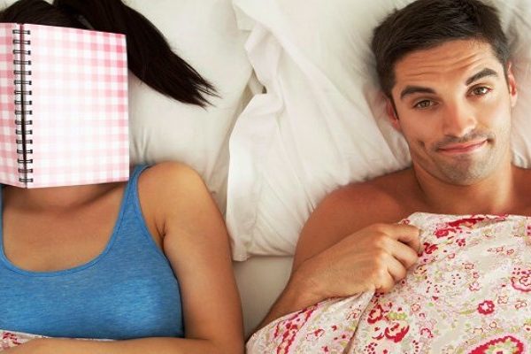 man-and-woman-with-book-in-bed