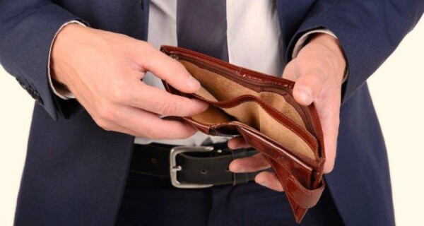 Close up of empty wallet in a man's hands