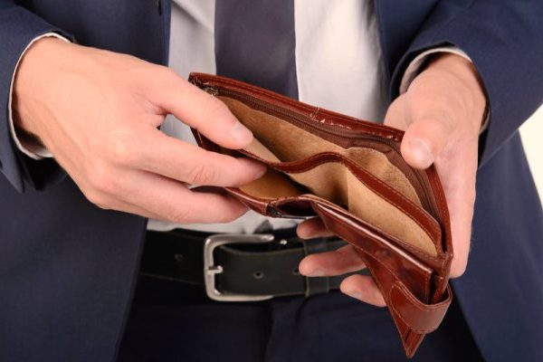 Close up of empty wallet in a man's hands