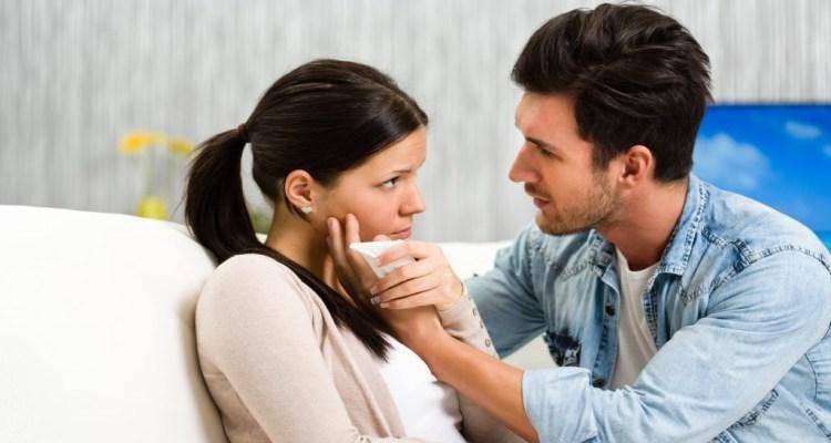 man comforting woman
