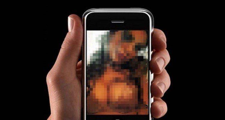 man holding phone watching video