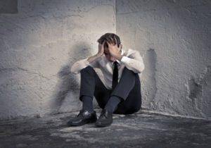 man in corner