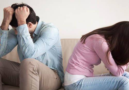 sad man and woman not talking to each other