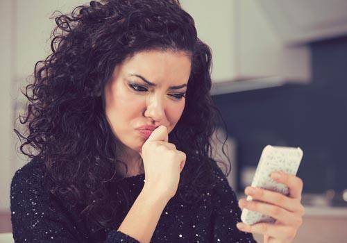 confused woman on mobile