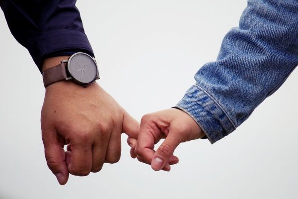 couple holding hands together