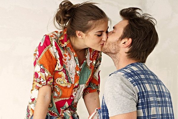couple kissing in white background