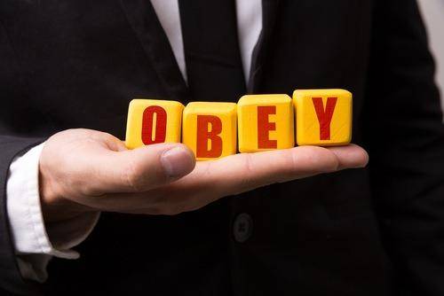 obey letters in man's hand