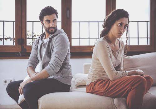 sad couple sitting