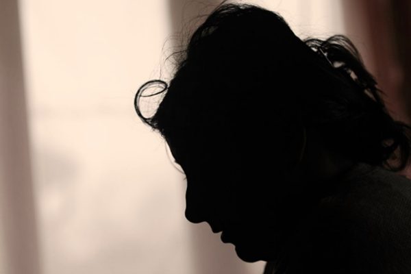 sad woman in shadow