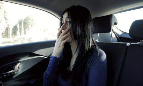 woman crying in cab