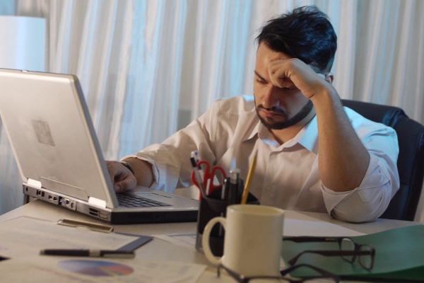 young sad man in the office