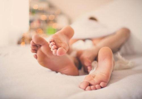 couple foot in bed