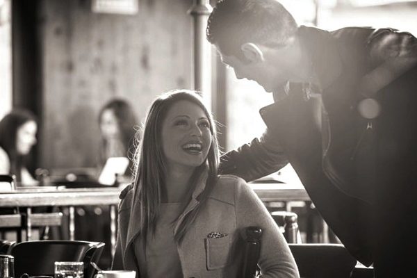 couple talking in black and white