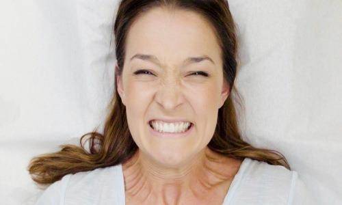 frustrated woman while doing waxing