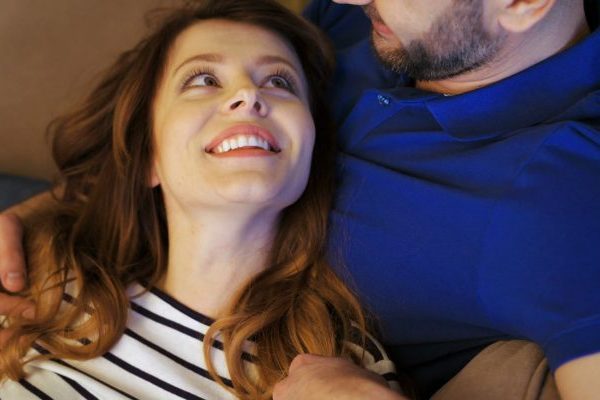 happy woman with her husband. There are romantic things that you can tell your husband to make him feel loved