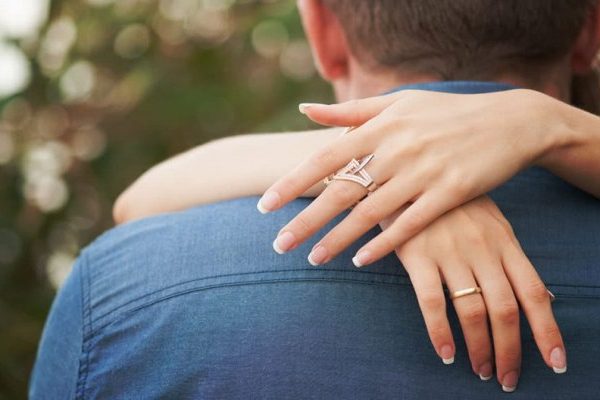 man and woman hugging in the park