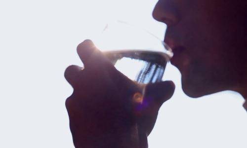 man drinking water