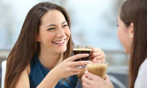 two happy woman talking