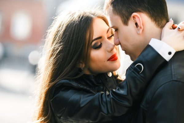 woman hugging man in public