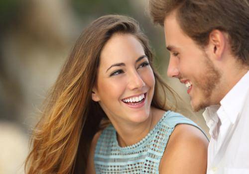 woman laughing with a man