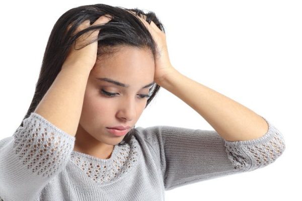 woman worried pulling hair
