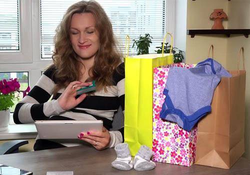 women shopping-baby-clothes
