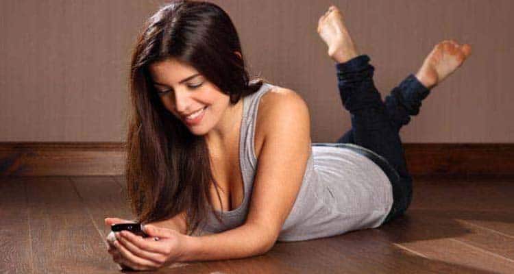 Girl texting and smilling