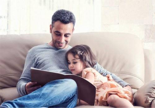 man teaching daughter
