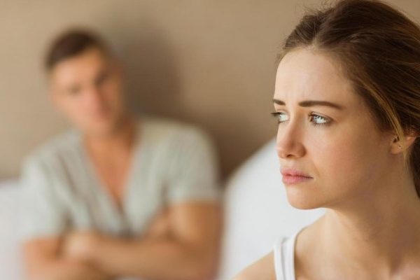 sad woman not talking with man