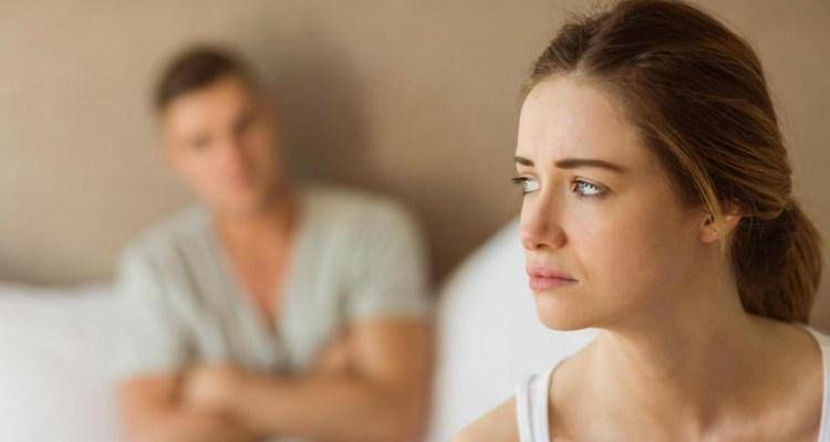 sad woman not talking with man