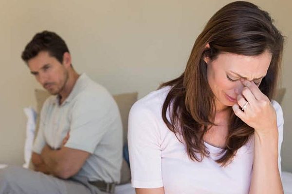 woman crying infront of man