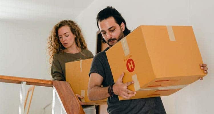 Couple moving out with pacakge