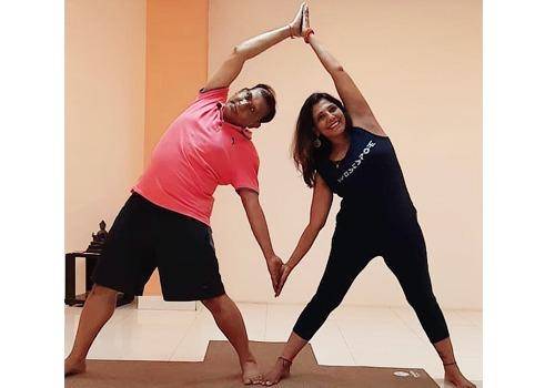 Yoga asana 'Partner Lateral Bend Pose' gives a good stretch to the side of your body