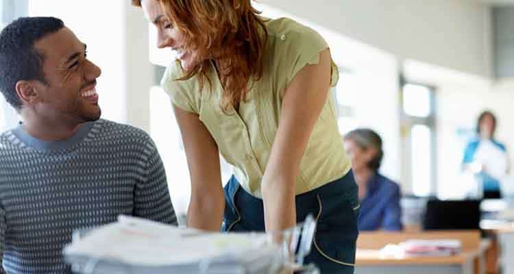 couple laughing in office