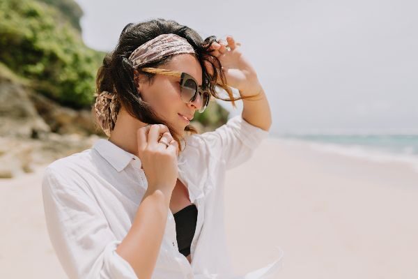 woman on the beach, looking away