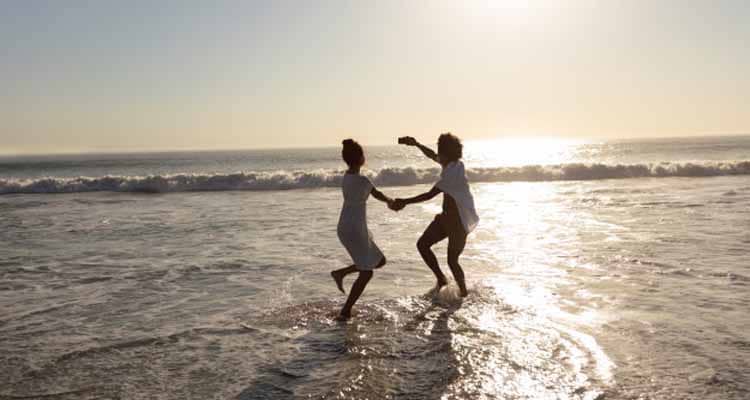 Couple taking selfie in water