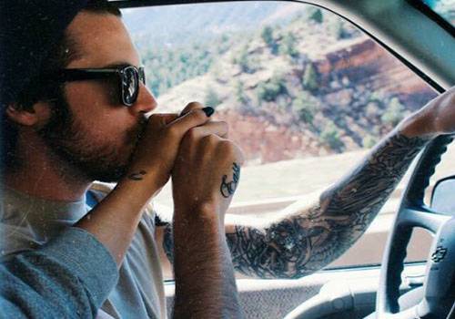 couple taking selfie while going for drive