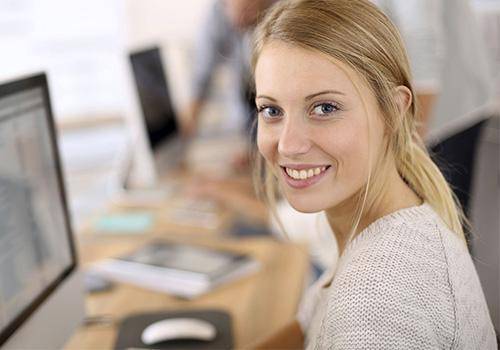 working woman in office. body language mistakes women make
