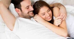 funny wide eyed couple in bed