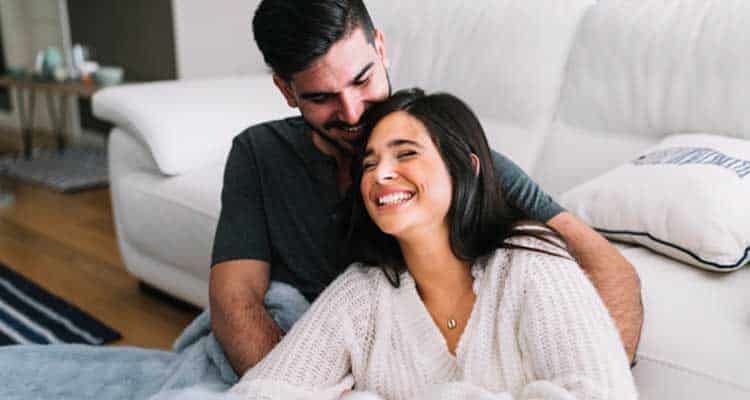 Happy couple on couch