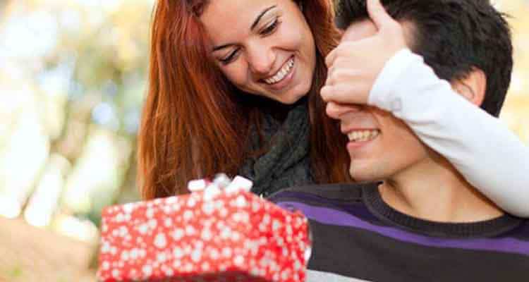 Girl gives gift to boy