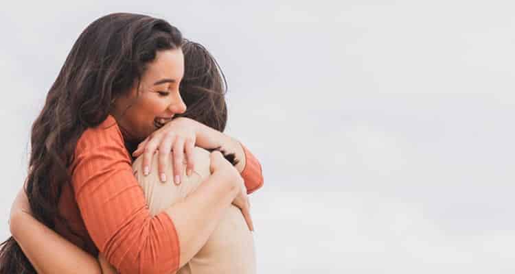 Man hugging woman