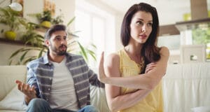 upset-couple-arguing-with-each-other-sofa
