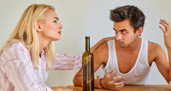 drunk-man-fighting-quarrelling-with-his-wife-sitting-kitchen-table-with-depressed-daughter
