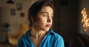 close-up-image-sad-student-girl-blue-shirt-looking-away-with-unhappy-facial-expression-being-bored-as-she-has-stay-home-prepare-exam-beautiful-young-female-posing-indoors