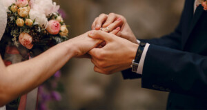 groom-putting-ring-bride-s-finger