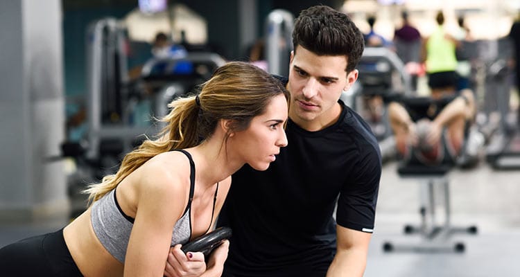 Young boy in gym with women