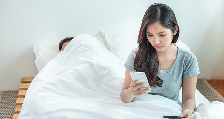 Women checking her boyfriend's phone