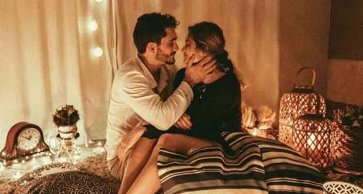 Couple having cozy time on bed